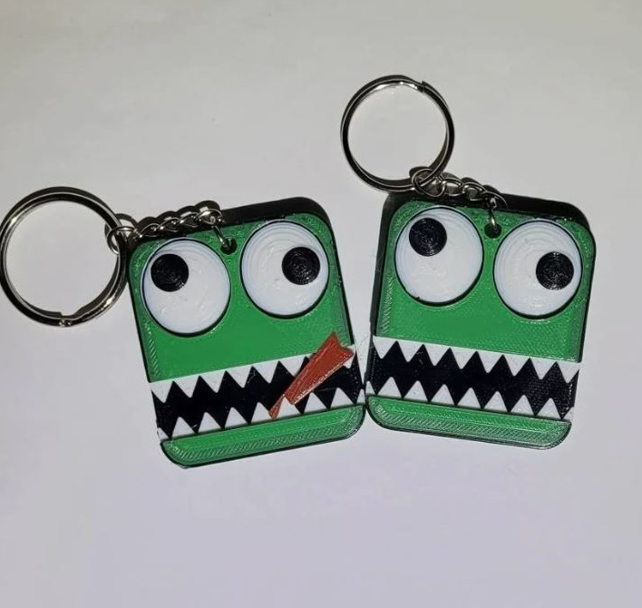 Contrive3D 3D Printed Rainbow Friends Keychains from the Roblox Monster Game. Lubbock, Texas. Green