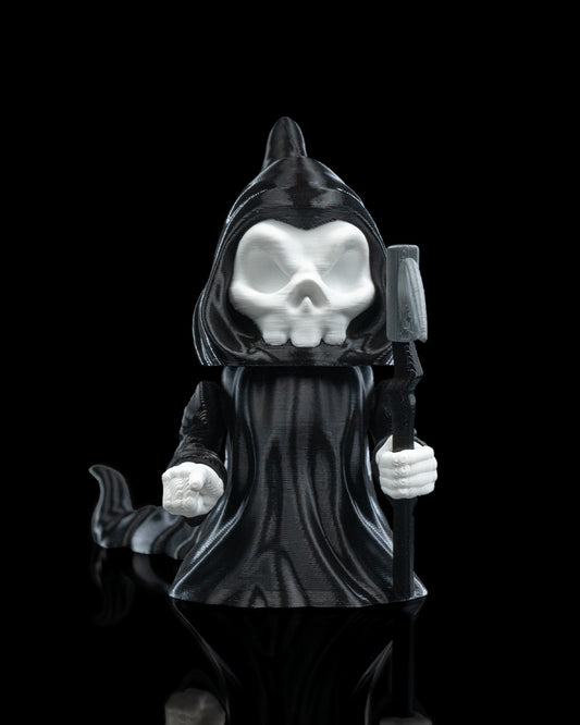 front view of 3D printed Grim Reaper flexi figurine named Death Wiggles, with skull face, hooded cloak, removable scythe, and flowing flexi cape.