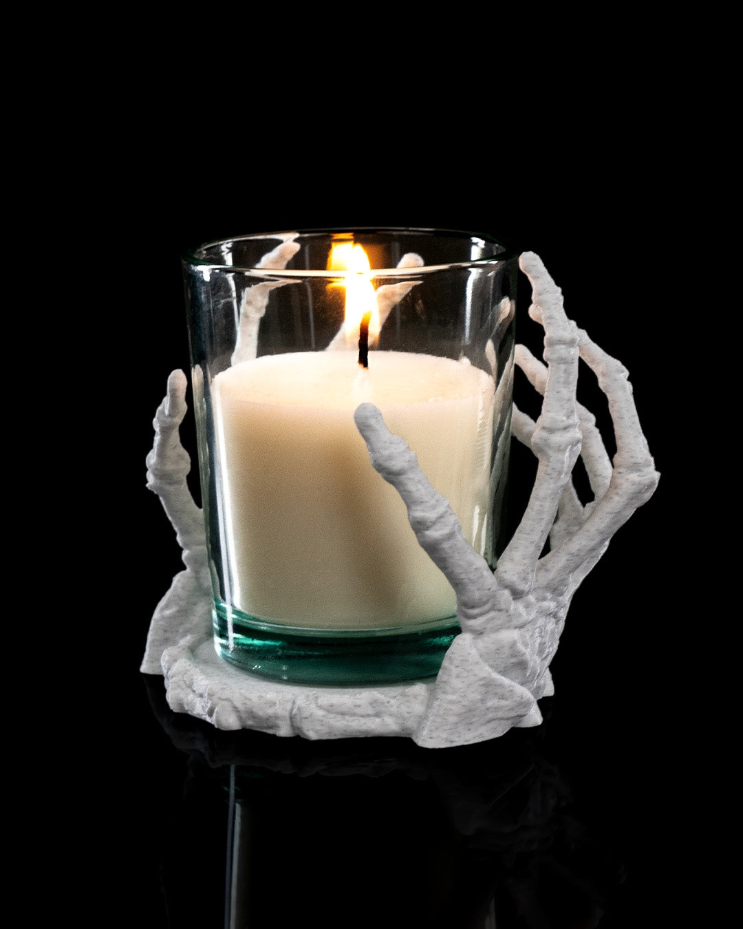 Angled View of Small Light Touch Skeleton Hands Candle Holder with glass votive candle inside