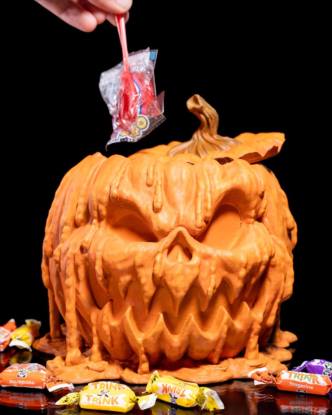 Orange PLA melting pumpkin candy holder, gothic and horror-inspired décor.