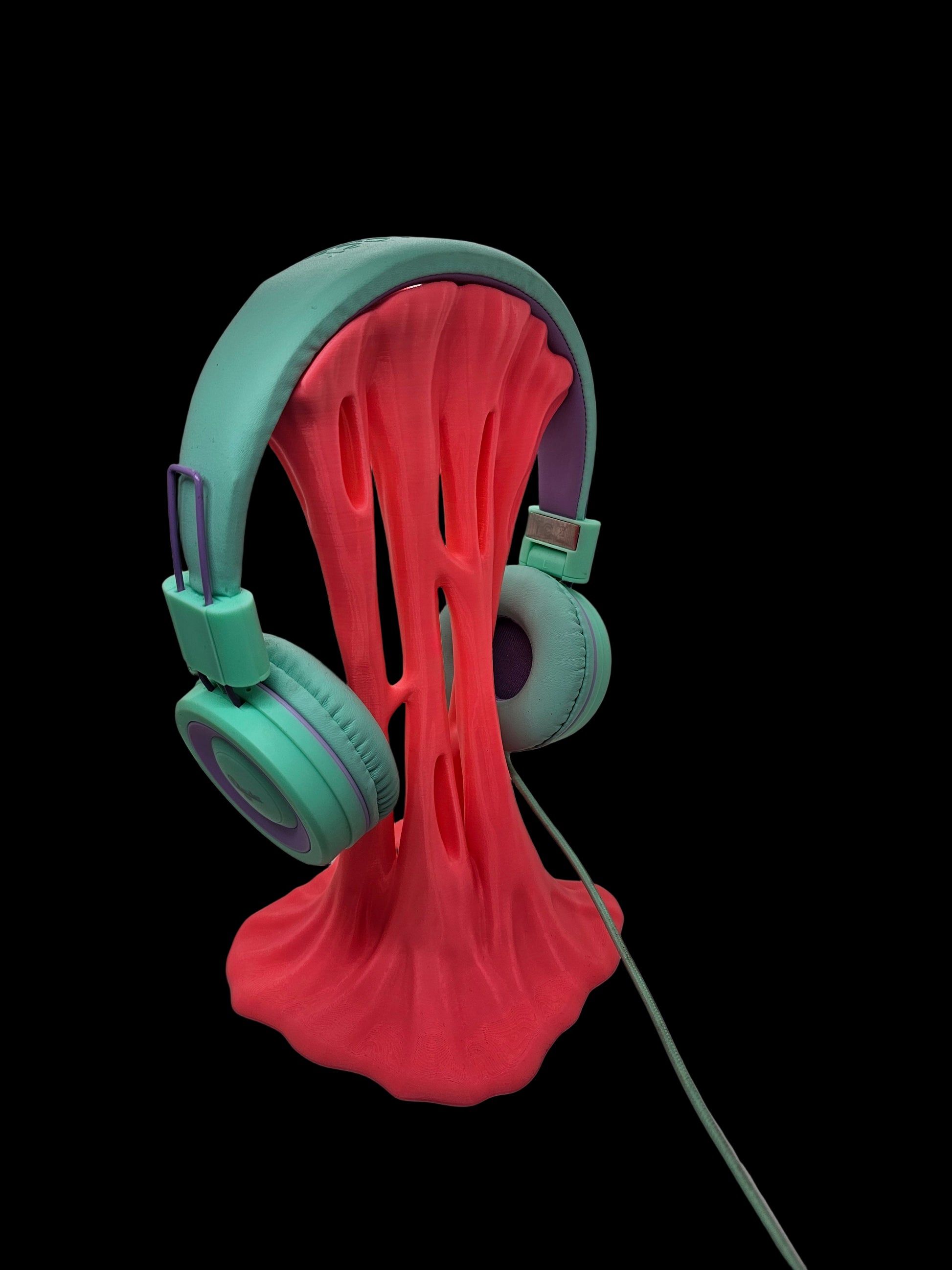 Pink headphone holder that resembles slime or chewing gum - printed in lubbock county texas by contrive3d