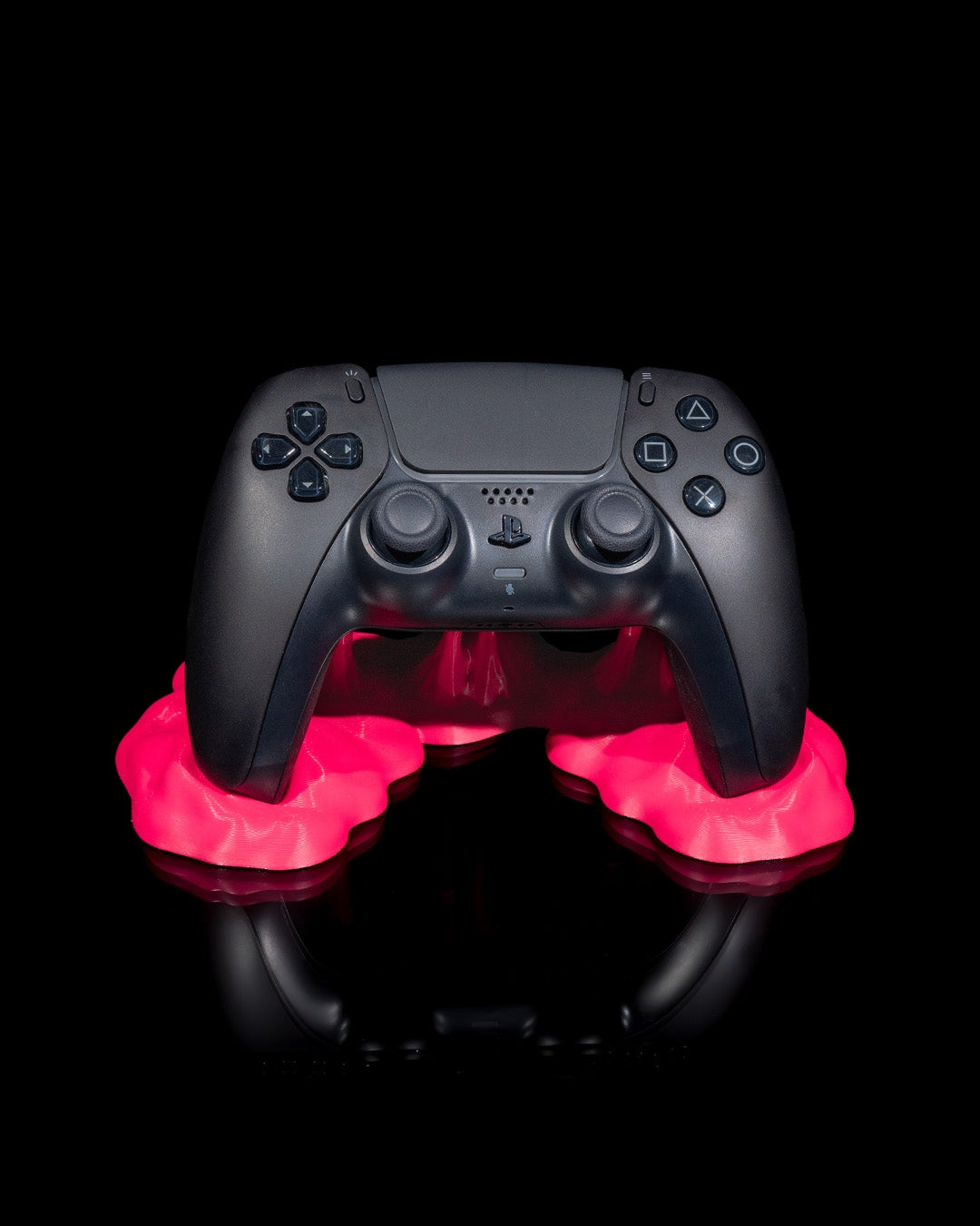Playstation controller displayed on neon slime-style Sticky Match Controller Holder