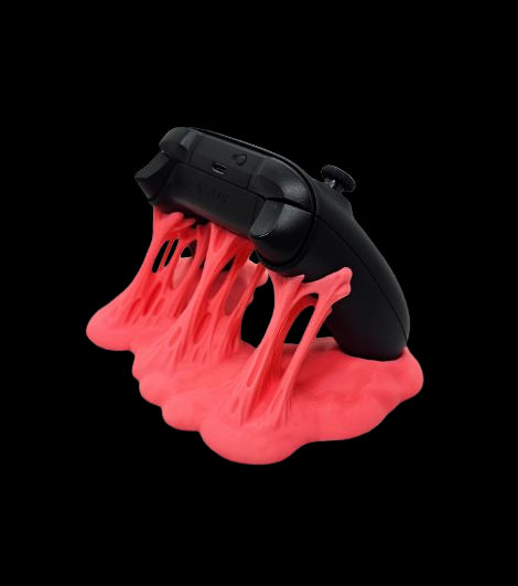 Sticky Match Controller Holder in neon pink holding PS5 controller – 3D printed accessory by Contrive3D