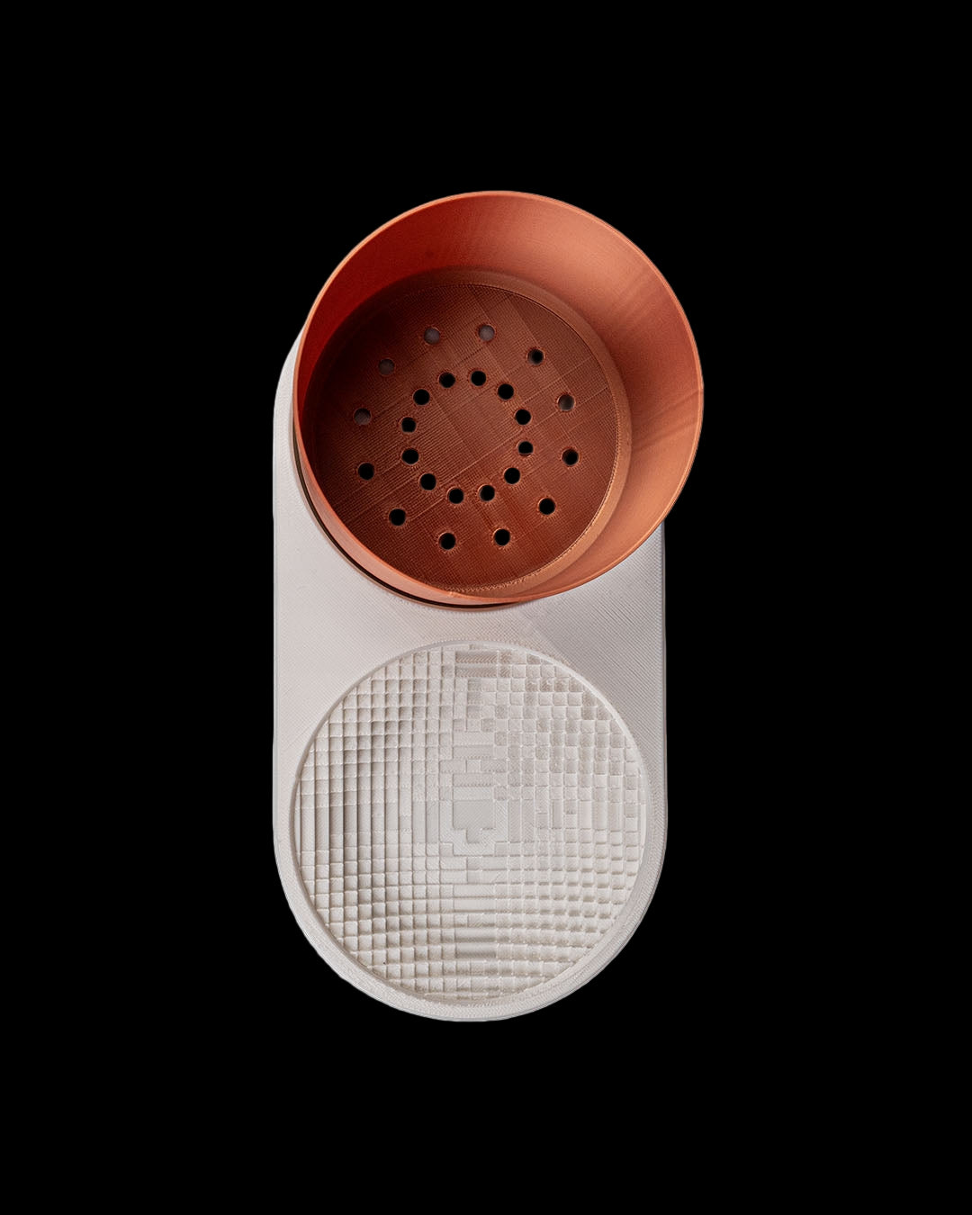 Dual-use VOXEL planter and desk organizer with enamel-sealed brown planter cup. Top view showing water drain holes