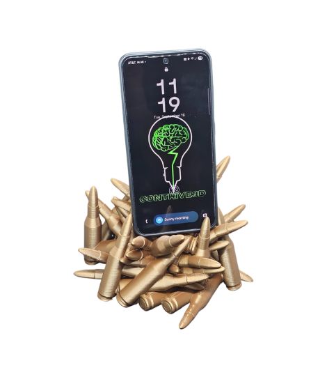 3D printed Ammo Pile Phone Holder, bullet design, front view with metallic bronze finish.