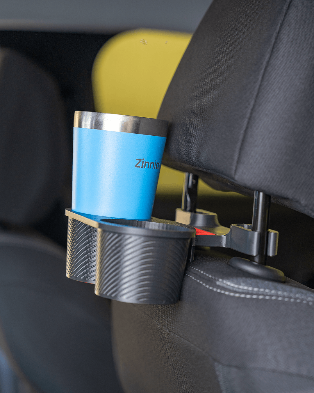 Dual cup holder attachment from AutoEase Complete Passenger Kit in back seat