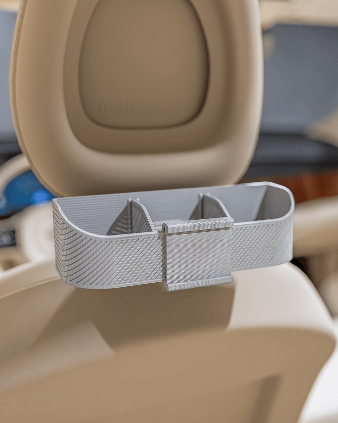 AutoEase Utility Kit tray installed on beige seat in car.