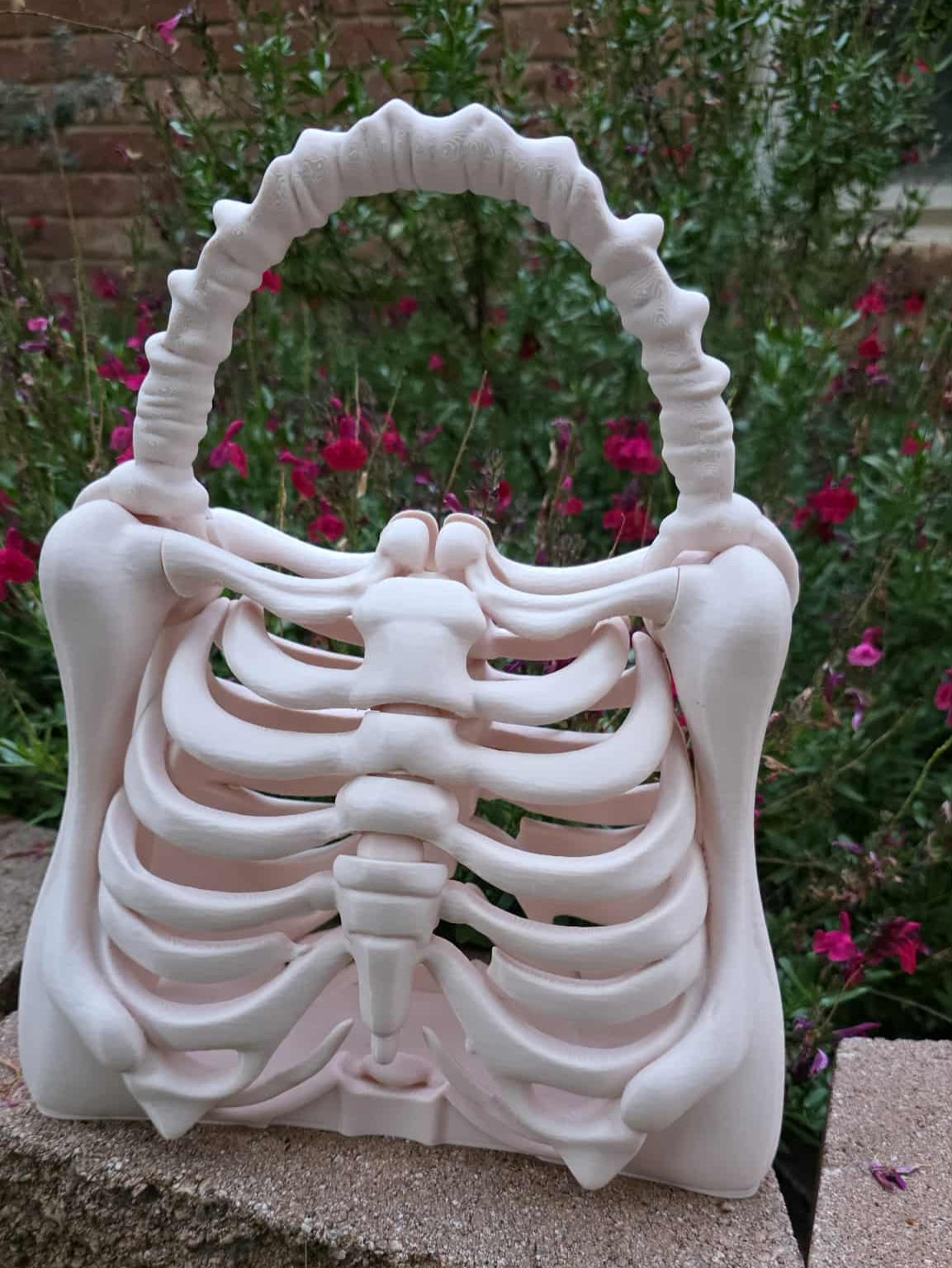 3D Printed in PLA by Contrive3D in Lubbock Texas 3D printed ribcage skeleton purse with bone-style handle in beige, gothic spooky fashion accessory, approximately 9.45” x 5.51” x 11.42”
