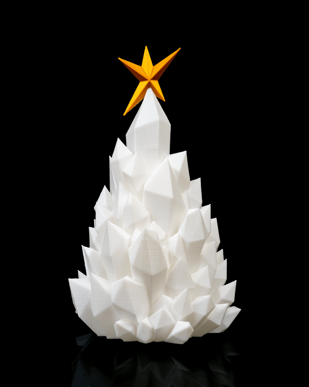 Front view of 3D printed Cryst-mas Tree showing faceted geometric design and gold star detail.