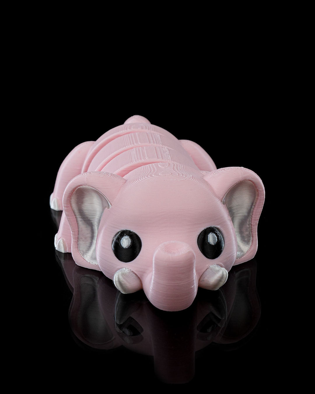 Front view of a 3D printed Cute Flexi Elephant toy with articulated segments and big expressive eyes.
