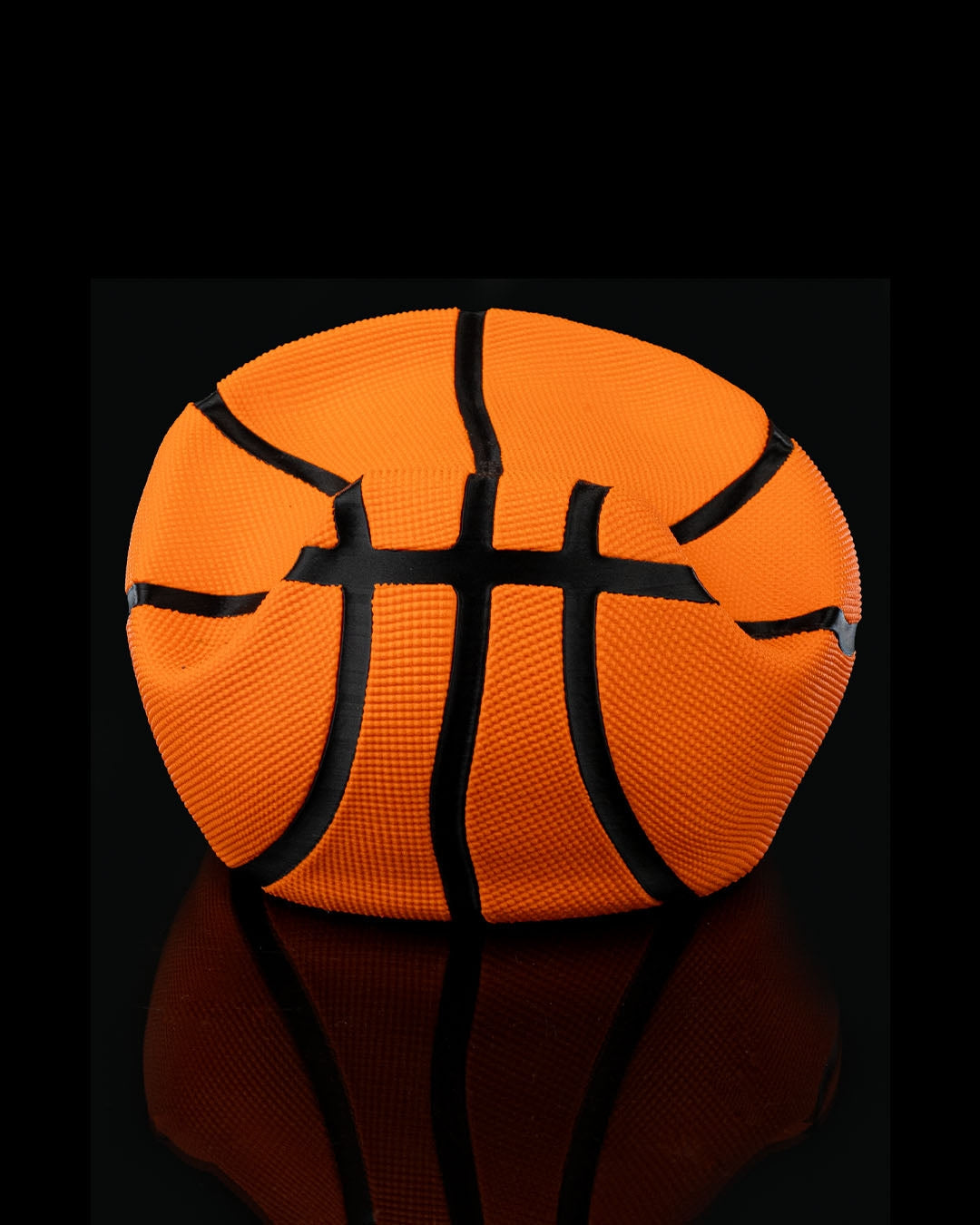 Basketball-themed gaming controller stand with realistic orange and black detailing