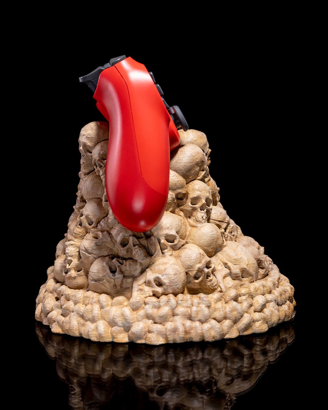 3D printed skull mound controller holder for Xbox and PlayStation controllers, painted in bone finish - side view