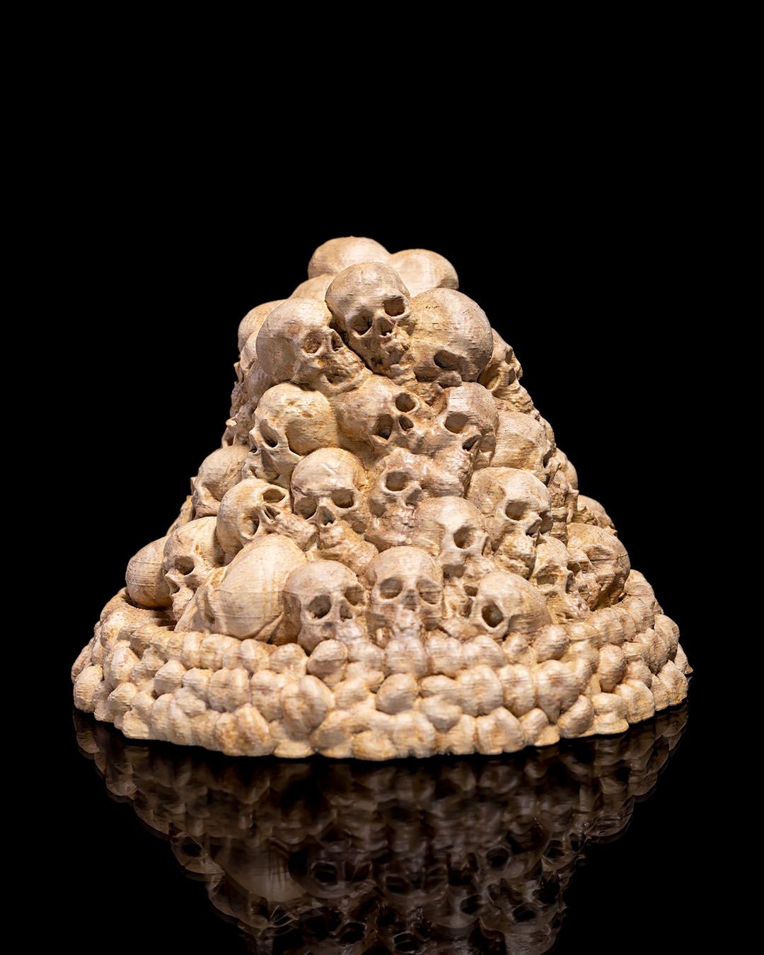 3D printed skull mound controller holder for Xbox and PlayStation controllers, painted in bone finish.