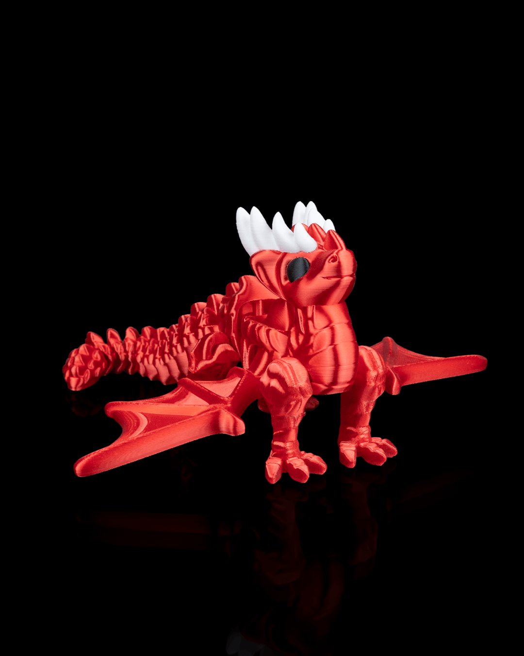 Front view of the 3D printed Flexi Dragon Legend showing its detailed articulated wings and body