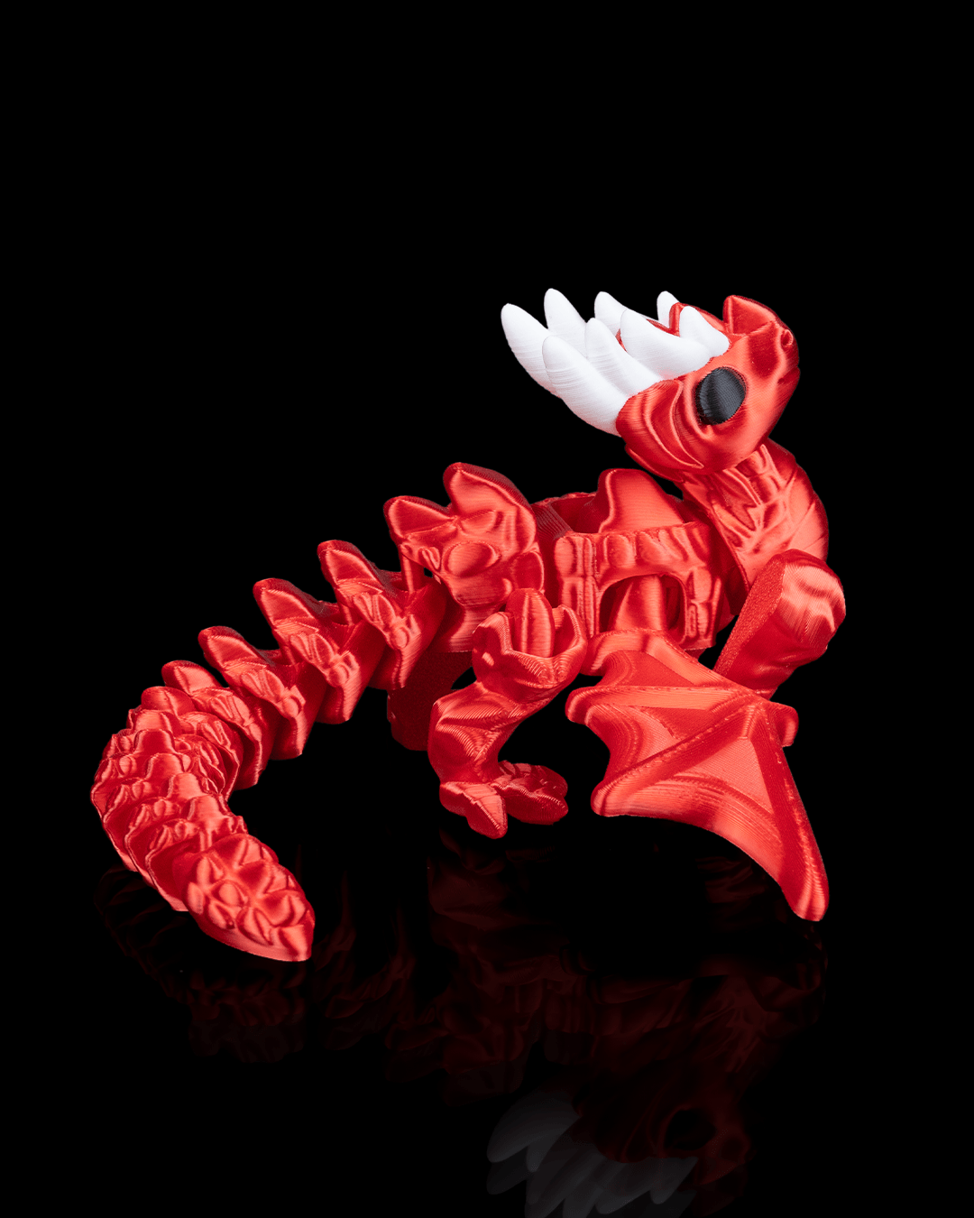 Side view of the Flexi Dragon Legend highlighting its flexible segments and sculpted dragon features."