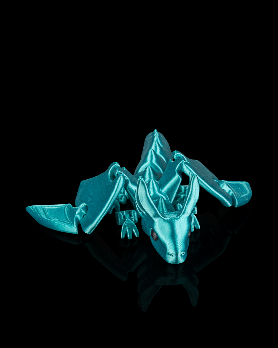 Flexi Sky Dragon 3D printed articulated dragon in teal color, front view. Teal color no longer available
