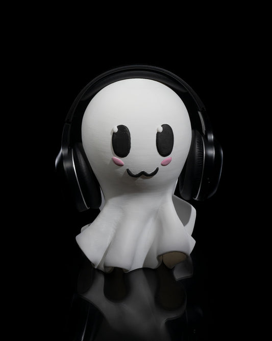 3D printed Ghost Headphone Holder with cute painted ghost face holding headphones.