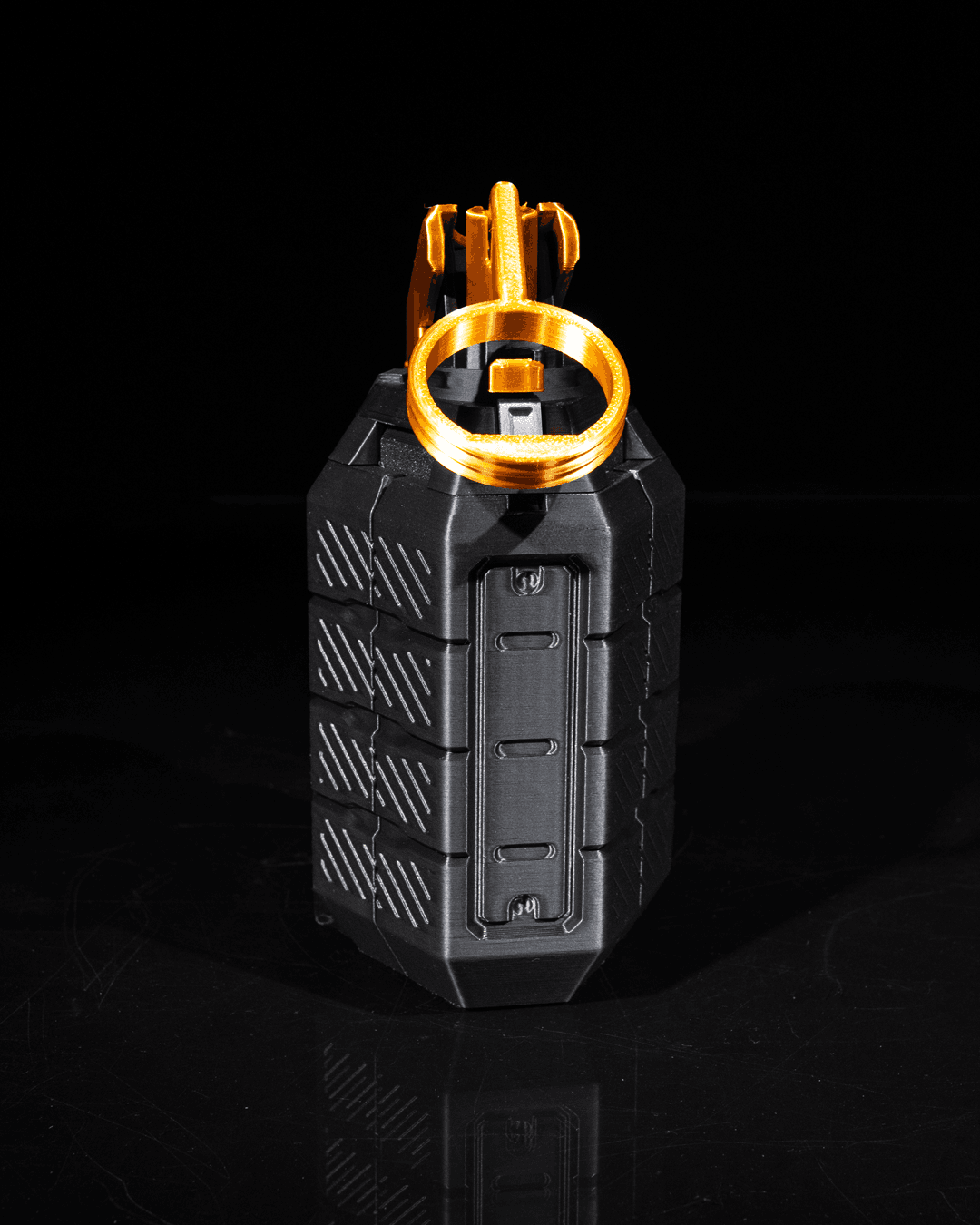 Grenade portable controller holder in closed position, 3D printed in black PLA with ring detail.