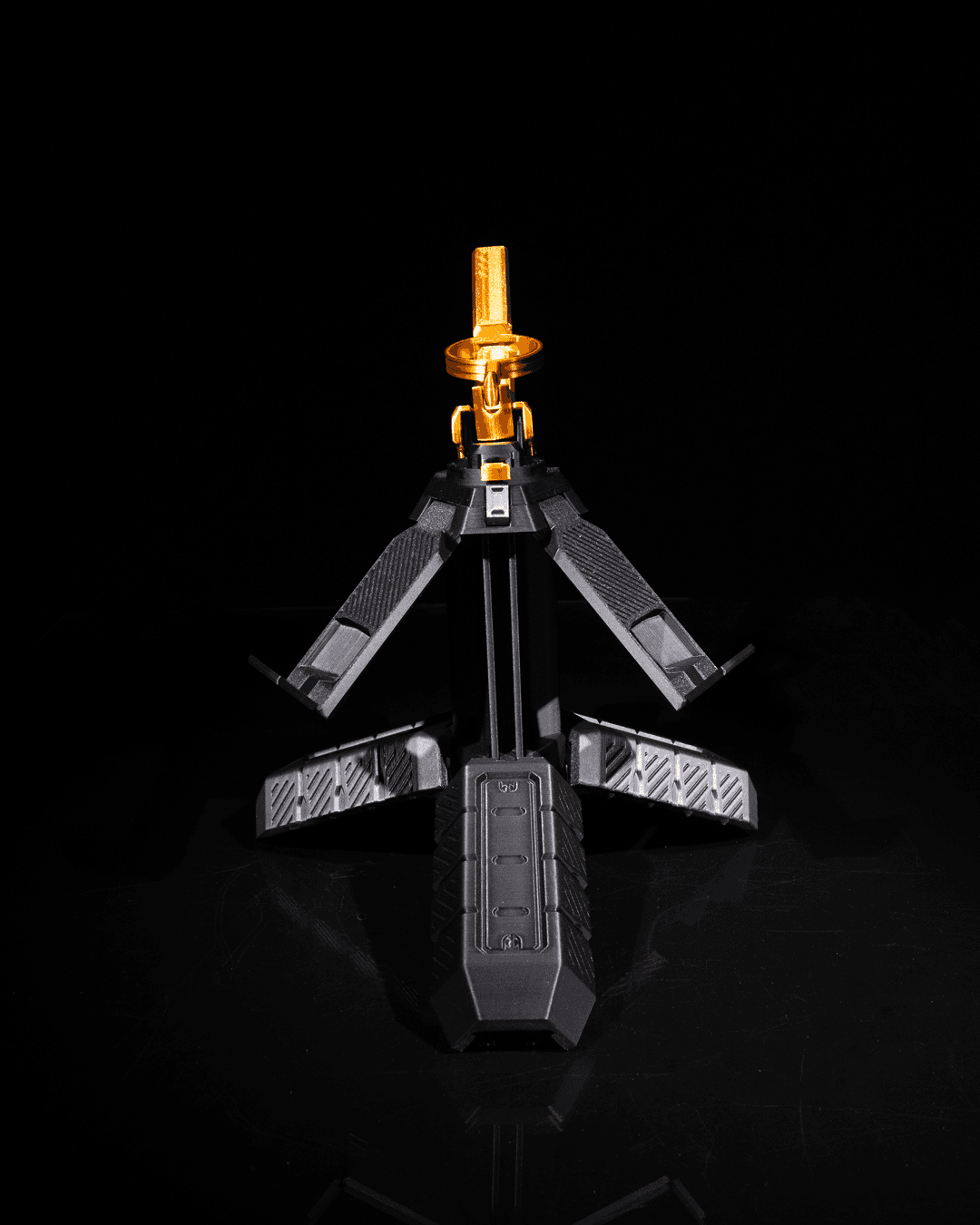 Grenade controller holder unfolded into multi-tier stand for controllers, black with latch detail.