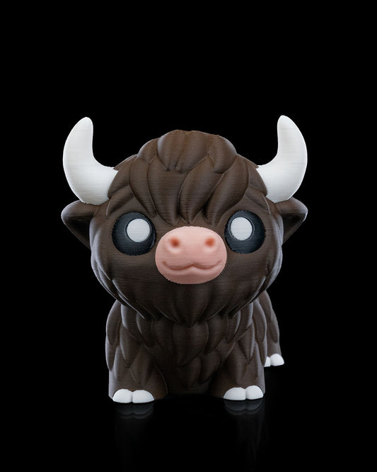 3D printed articulated Highland Cow figure, front view, approximately 10cm tall, with detailed fur texture and white horns.