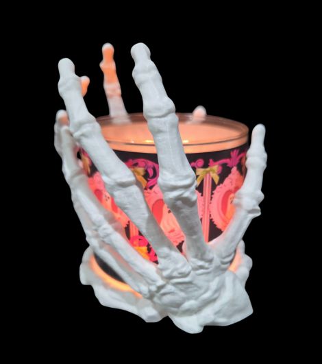 Large Light Touch Skeleton Hands Candle Holder holding a Bath & Body Works 3-wick candle