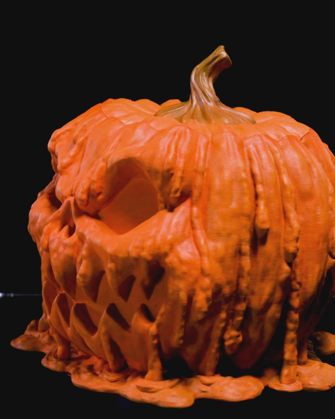 Video of 3D printed Halloween pumpkin candy bowl with creepy melting design, made in Lubbock, TX