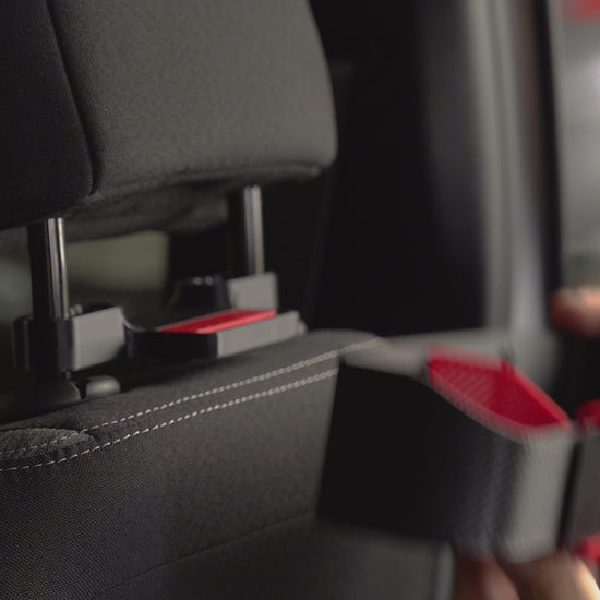 AutoEase Utility Kit tray installed on beige seat in car.