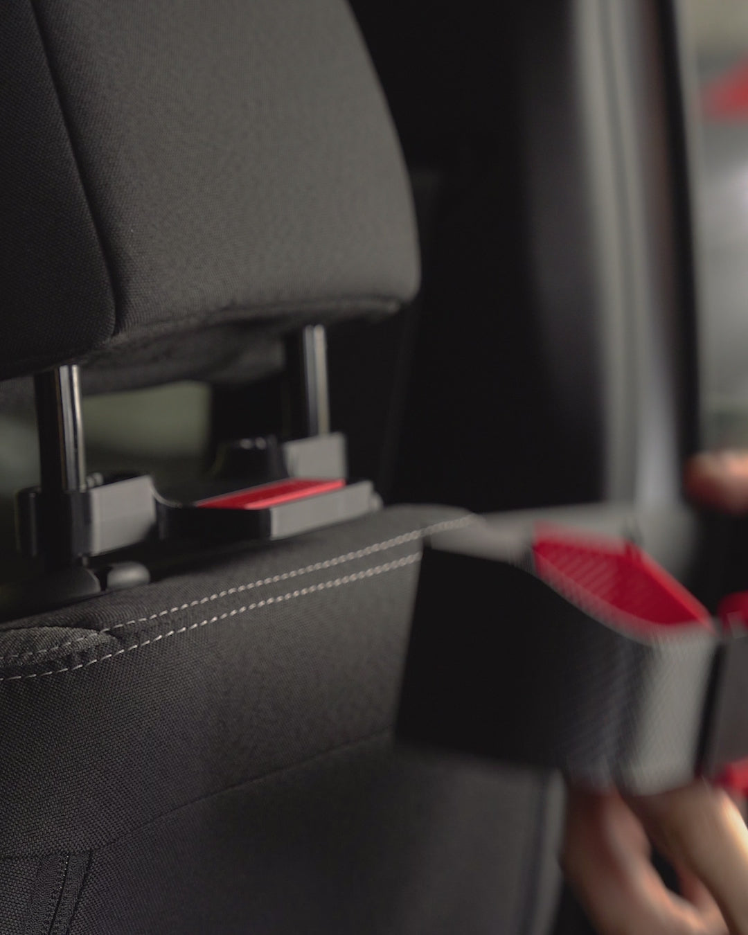 AutoEase Utility Kit tray installed on beige seat in car.
