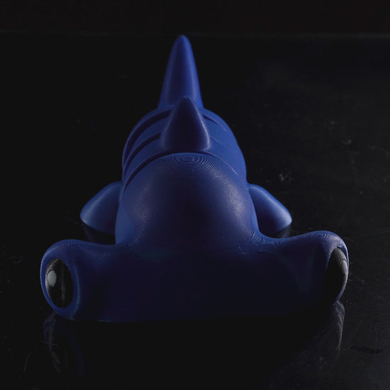Demonstration video showing the movement and articulation of the flexi hammerhead shark in keychain, magnet, and toy sizes.