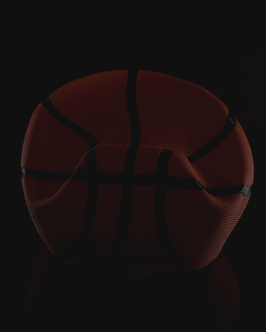 Deflated basketball controller stand in multicolor orange and black video showing multiple angles.