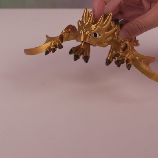 Video showing the articulation and flexible movement of the 3D printed Flexi Wyvern figurine
