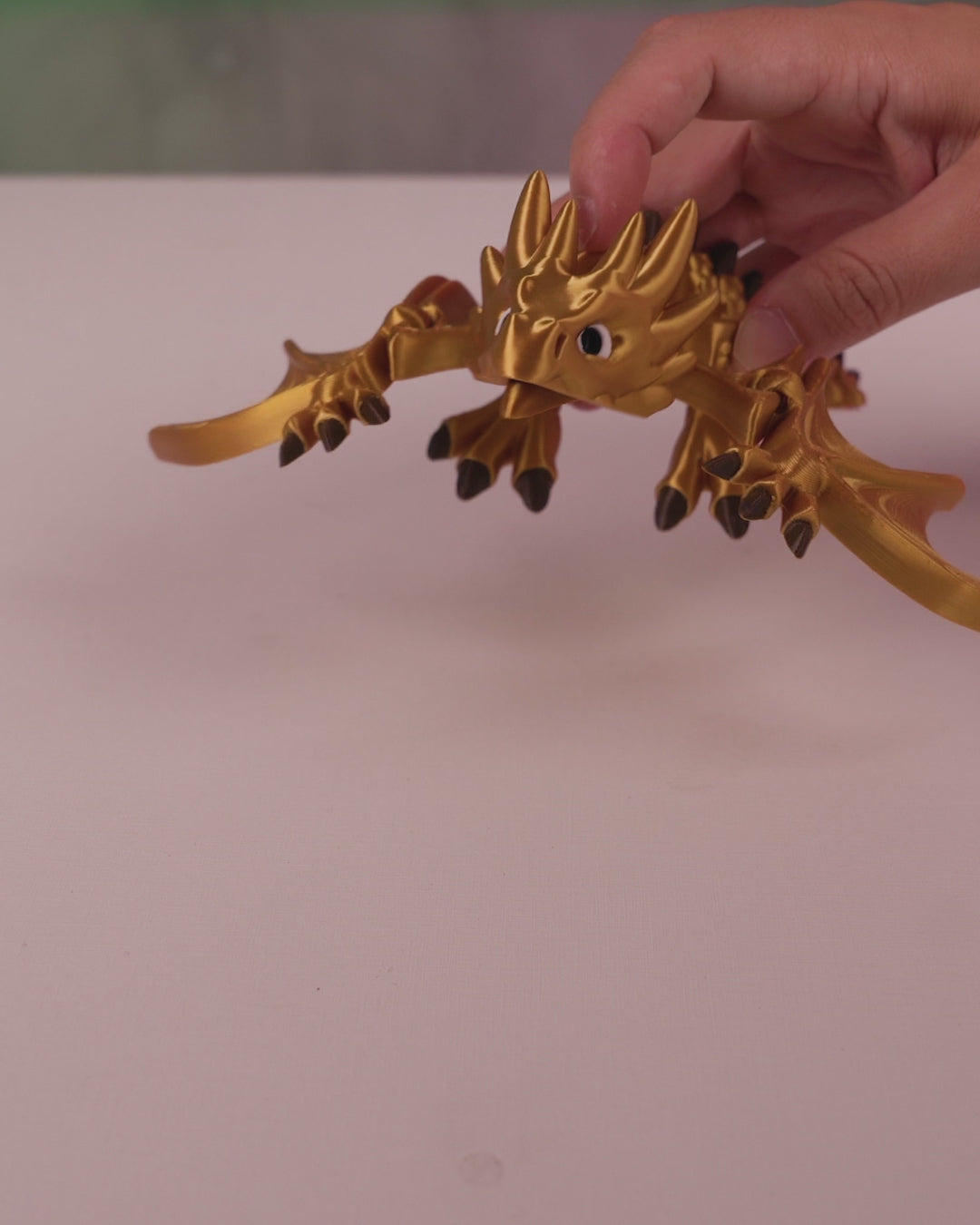 Video showing the articulation and flexible movement of the 3D printed Flexi Wyvern figurine