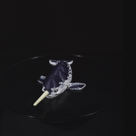 Demonstration of the Flexi Narwhal toy bending and moving to show its full articulation.