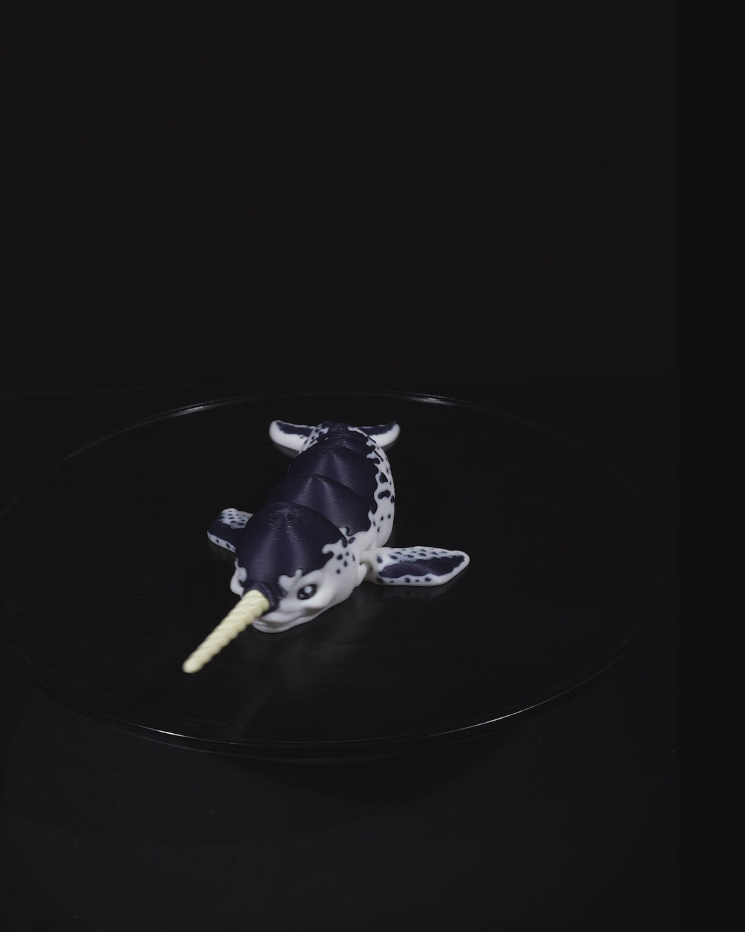 Demonstration of the Flexi Narwhal toy bending and moving to show its full articulation.