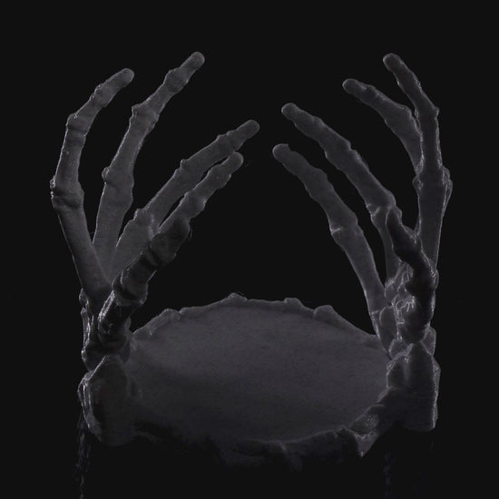 Gothic skeleton hand candle holder, perfect for Halloween décor or altar lighting - video