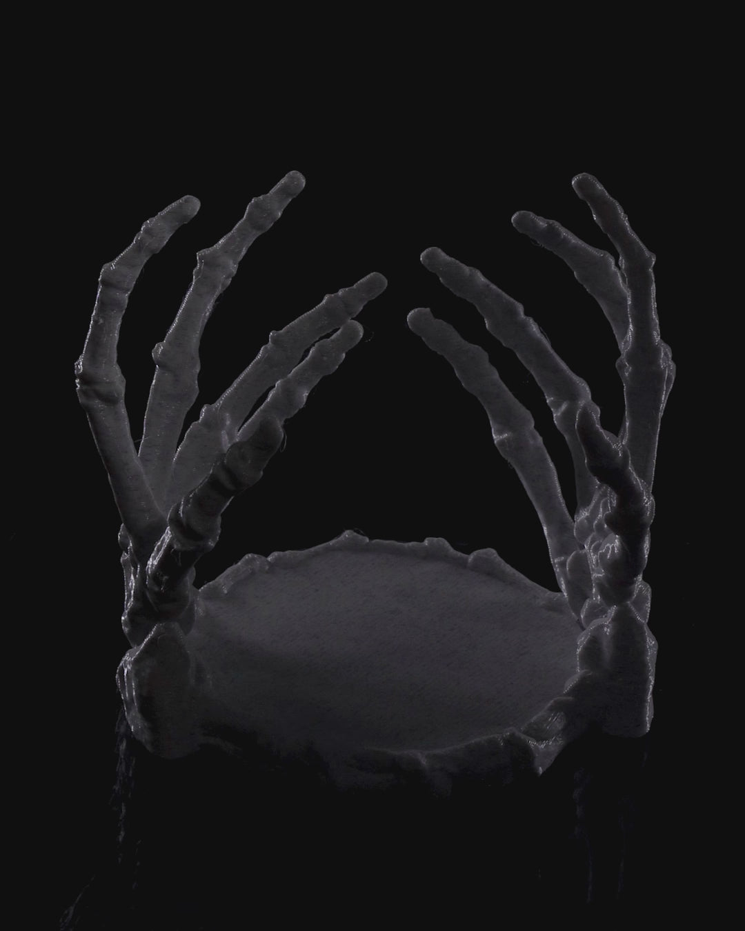 Gothic skeleton hand candle holder, perfect for Halloween décor or altar lighting - video