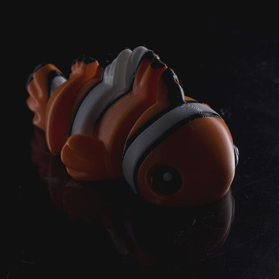 Demonstration video showing the movement and flexibility of the 3D printed flexi clownfish in keychain, magnet, and toy sizes.