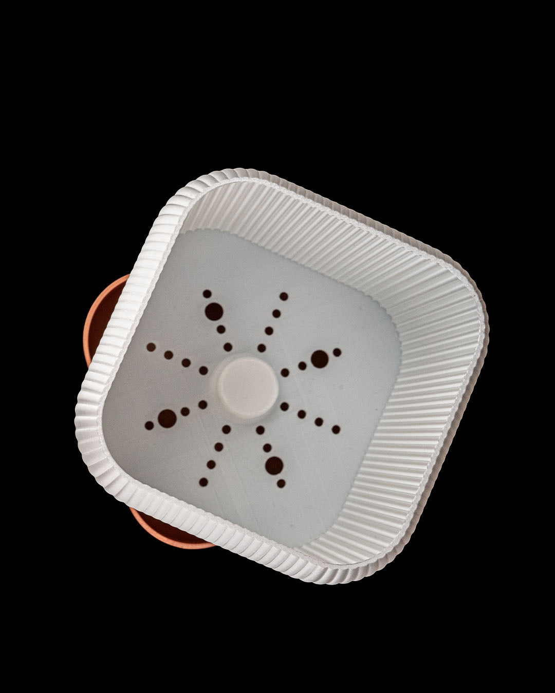 Top view of QUADRA self-watering planter showing integrated water reservoir system