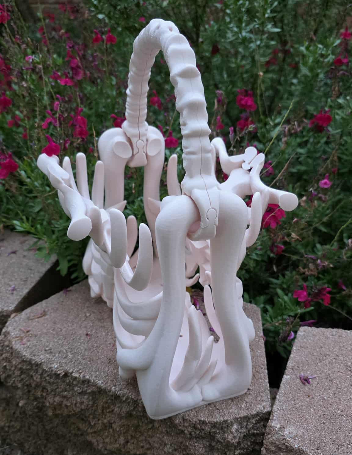 3D printed ribcage skeleton purse with bone-style handle in beige, gothic spooky fashion accessory, approximately 9.45” x 5.51” x 11.42” - angled and open view 