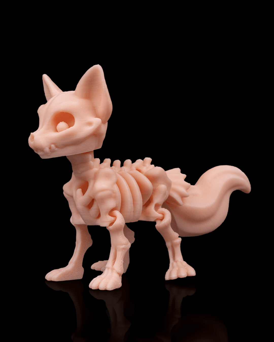 Angled profile of Skeleton Fidget Fox 3D print in beige PLA showing skeletal body and tail.