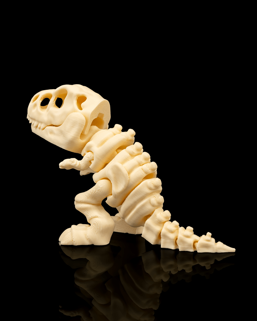 Angled view of 3D printed Skeleton T-Rex miniature emphasizing realistic bone texture.