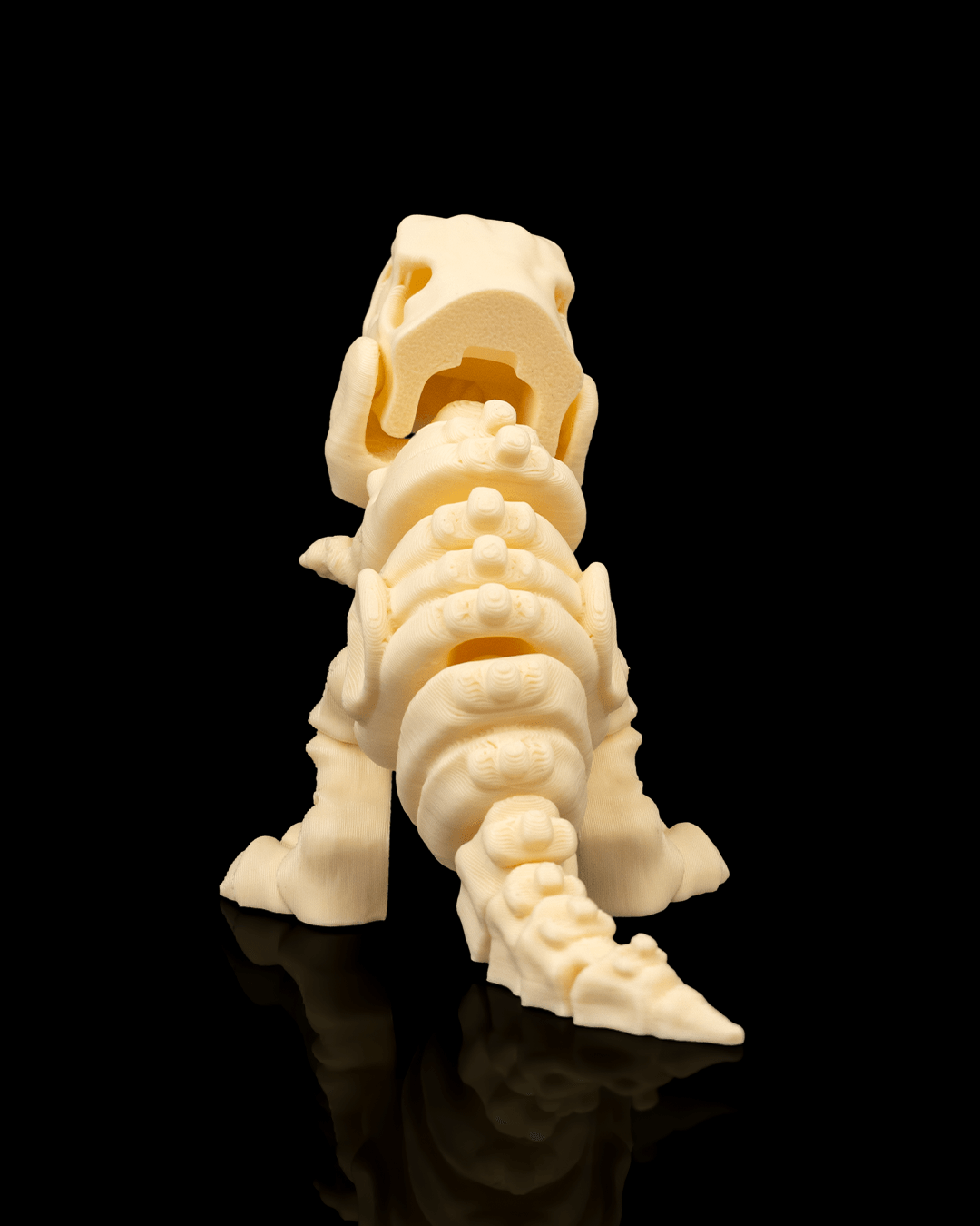 Rear view of 3D printed Skeleton T-Rex miniature emphasizing realistic bone texture.