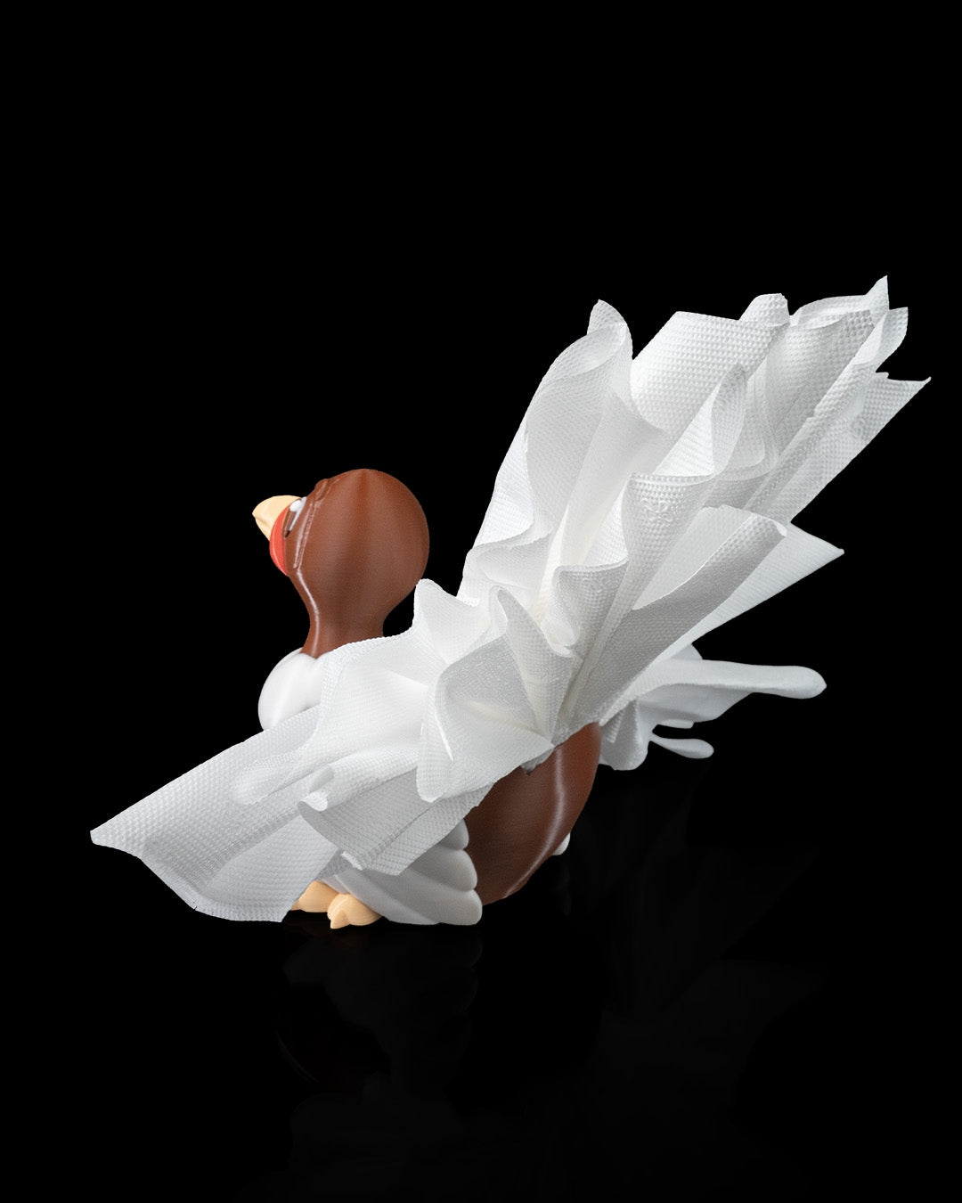 Angled view of the 3D-printed Turkey Fan Napkin Holder displaying napkins as tail feathers.