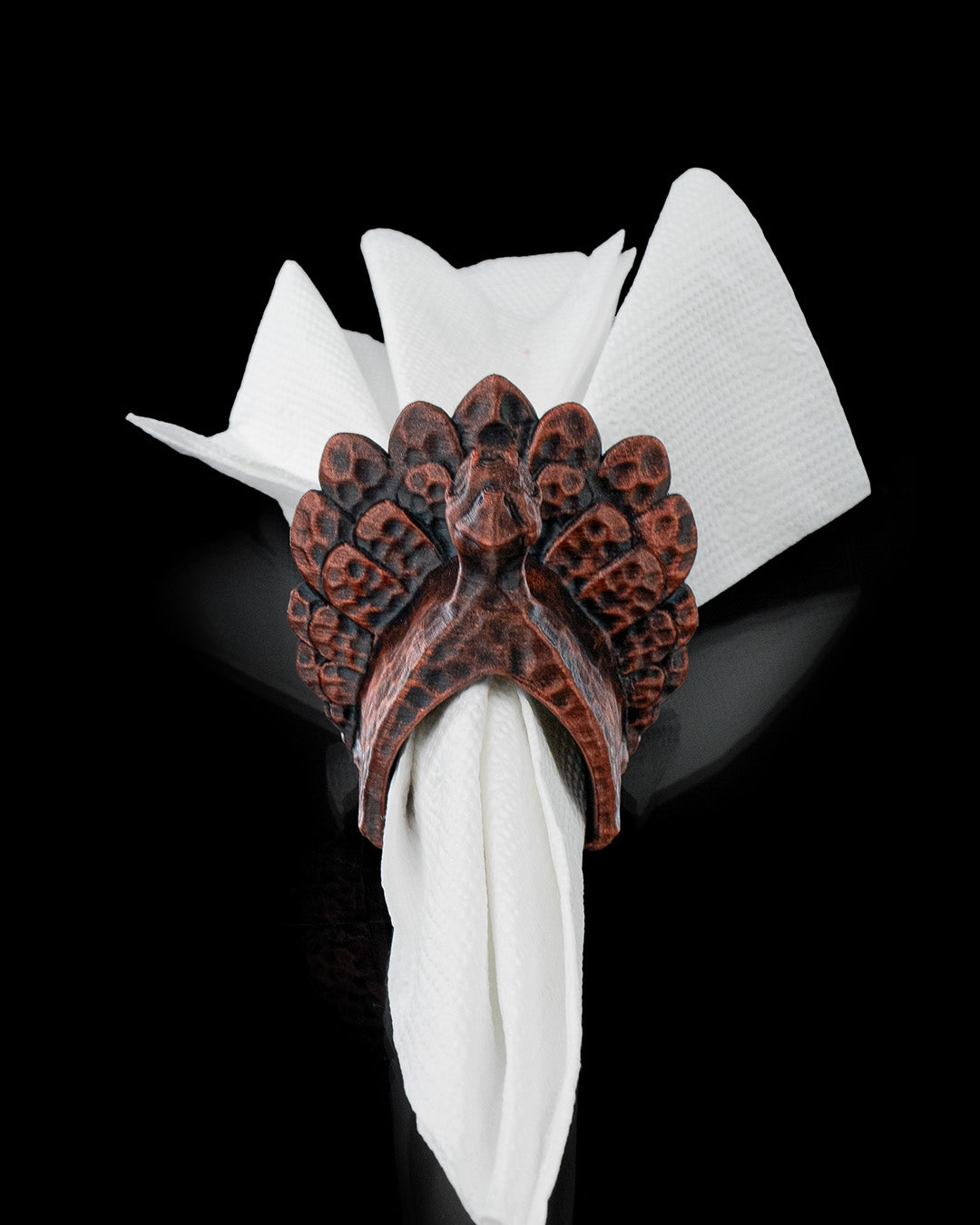 3D printed Turkey Ring Napkin Holder standing upright with textured feathers holding napkin.