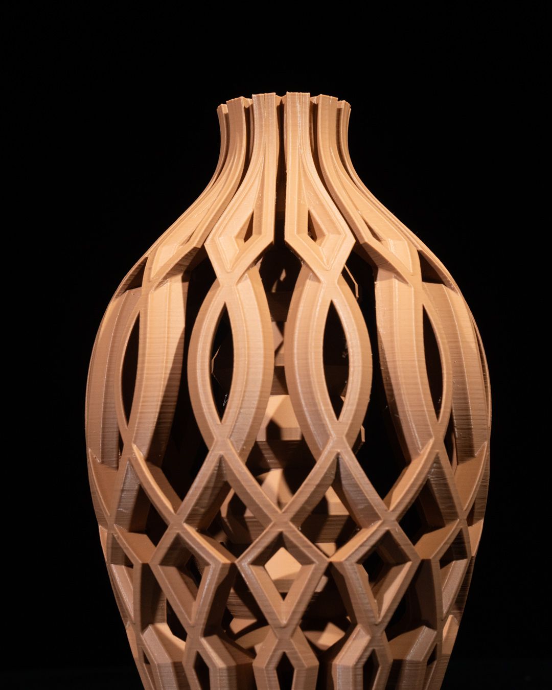 Close up of empty Vista Vase displaying its open geometric lattice structure, printed in brown PETG with enamel finish.